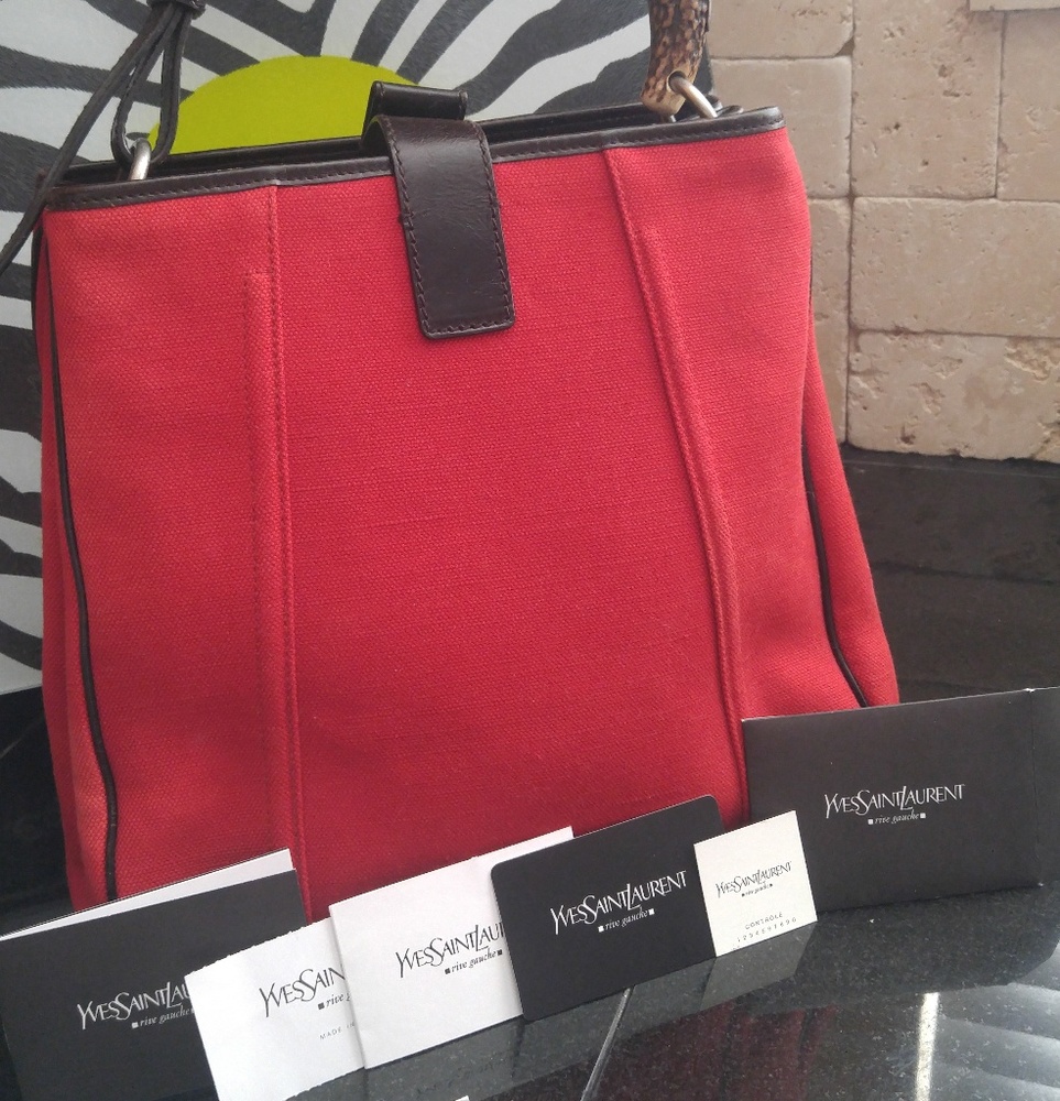 Yves Saint Laurent red canvas tusk shoulder bag.
